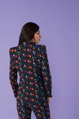 This stunning fitted tailored blazer is a showstopper, paired with matching flared trousers.   With shoulder pads and double breast.   Model wears S. 