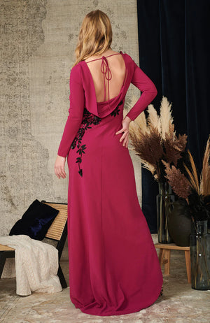 Featuring an open cowl back with tie detail, the maxi skirt hugs the figure and flows down to the floor to create a stunning silhouette. Black embellished florals stand-out against the deep berry purple base for a final touch of glamour to make you feel event-ready and fabulous.