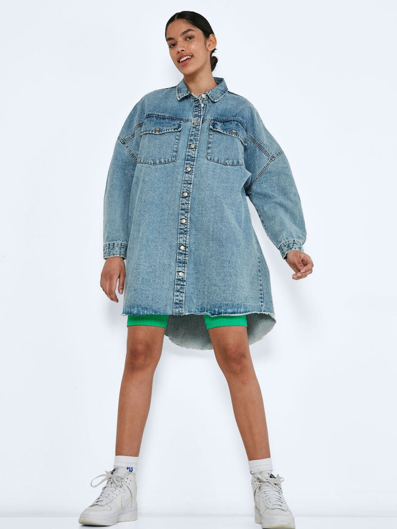 Noisy May Long denim shirt jacket - Non-stretchy cotton material  - Oversize fit  - Pointed collar  - Long sleeved  - Dropped shoulders  - Button fastenings through front  - Front flap pockets with button fastening  - Curved hemline with raw edges  - Button fastening at cuffs