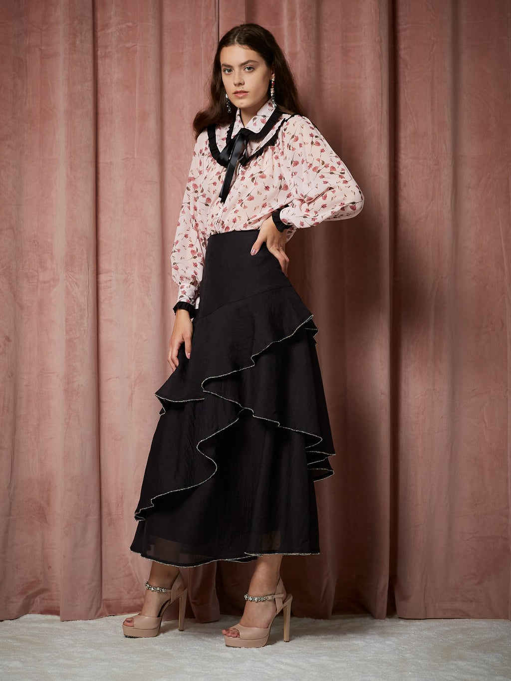 Sister Jane Spiral Gem Tiered black Midi skirt in a soft organza fabric, featuring an asymmetric tiered skirt, finished with a rainbow gem trim.