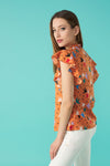 Round neck sleeveless top with honeycomb effect elastication. Ruffle detail on the shoulders.