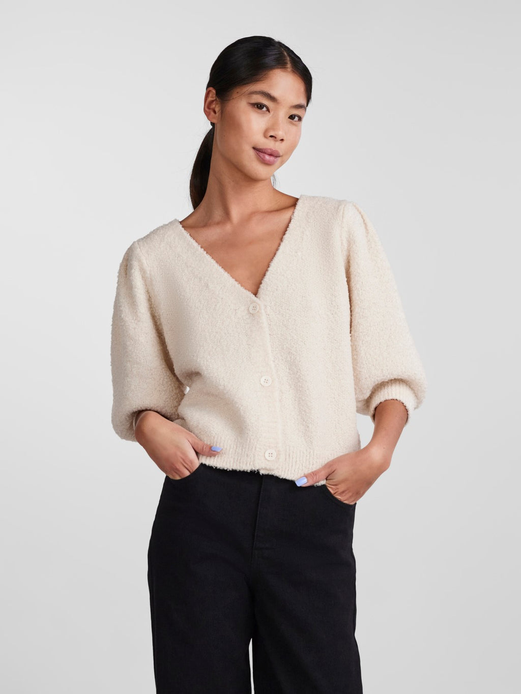 - V-neck  - Button-up front  - Half-length puff sleeves  - Ribbed trims  - Fluffy texture  - Regular fit