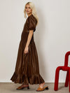 Ghospell Puff sleeve maxi dress in a soft faux leather fabric. Featuring a shirred waist and pleated hem. 