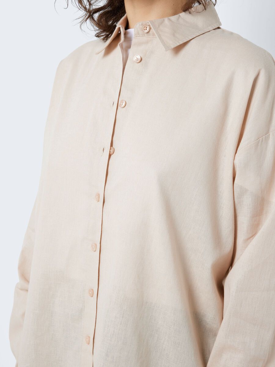 - Oversize shirt  - Button fastenings through front  - Long sleeves with dropped shoulders  - Pointed collar  - Button fastening at cuffs  - Cotton and linen blend material