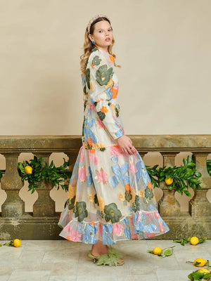 Sister Jane DREAM Primula Postcard Maxi Dress .  A rainbow of florals scatters your sheer organza maxi dress, baby blues, oranges and greens galore! As if a postcard painted by a local artist, this one-of-a-kind style has details of puffed sleeves with long fitted cuffs, finished with a high neck and staggered tiers...the Primula Postcard Maxi Dress took your breath away all vacation long.